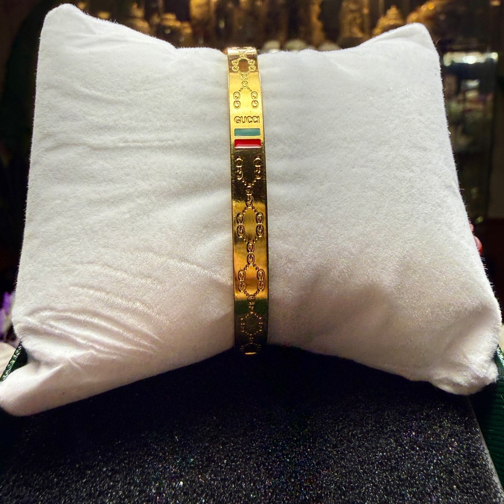 Gold Bracelet with Red and Green Accents